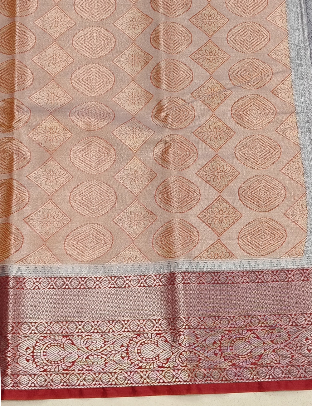 Circular Motifs Pale Orange Dual Tone Tissue Silk Saree