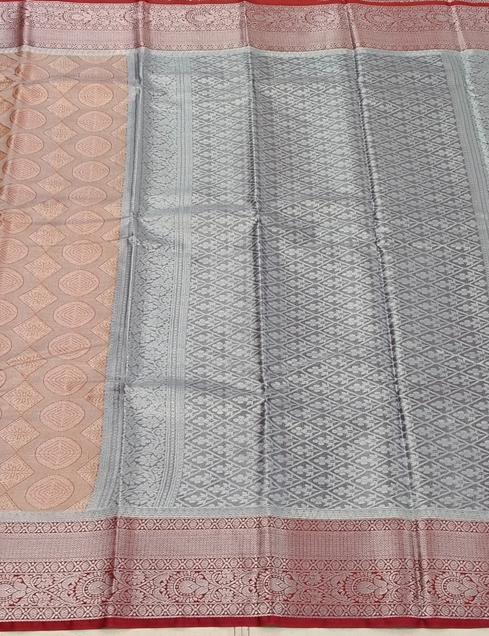 Circular Motifs Pale Orange Dual Tone Tissue Silk Saree